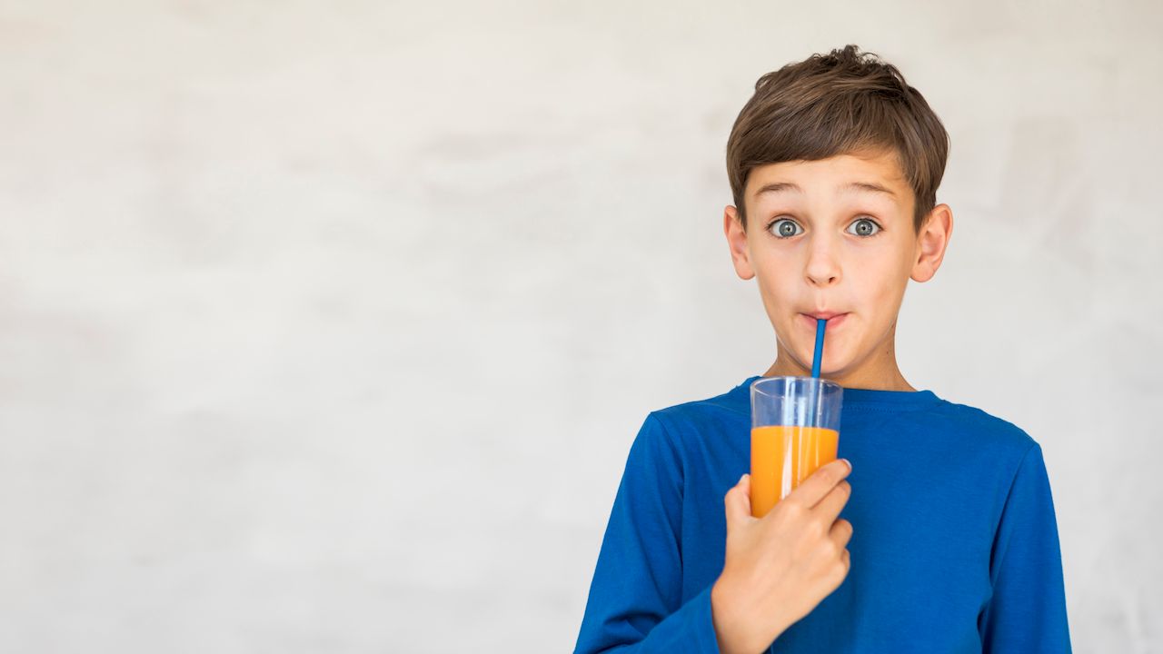 adorable-kid-drinking-some-orange-juice.jpg
