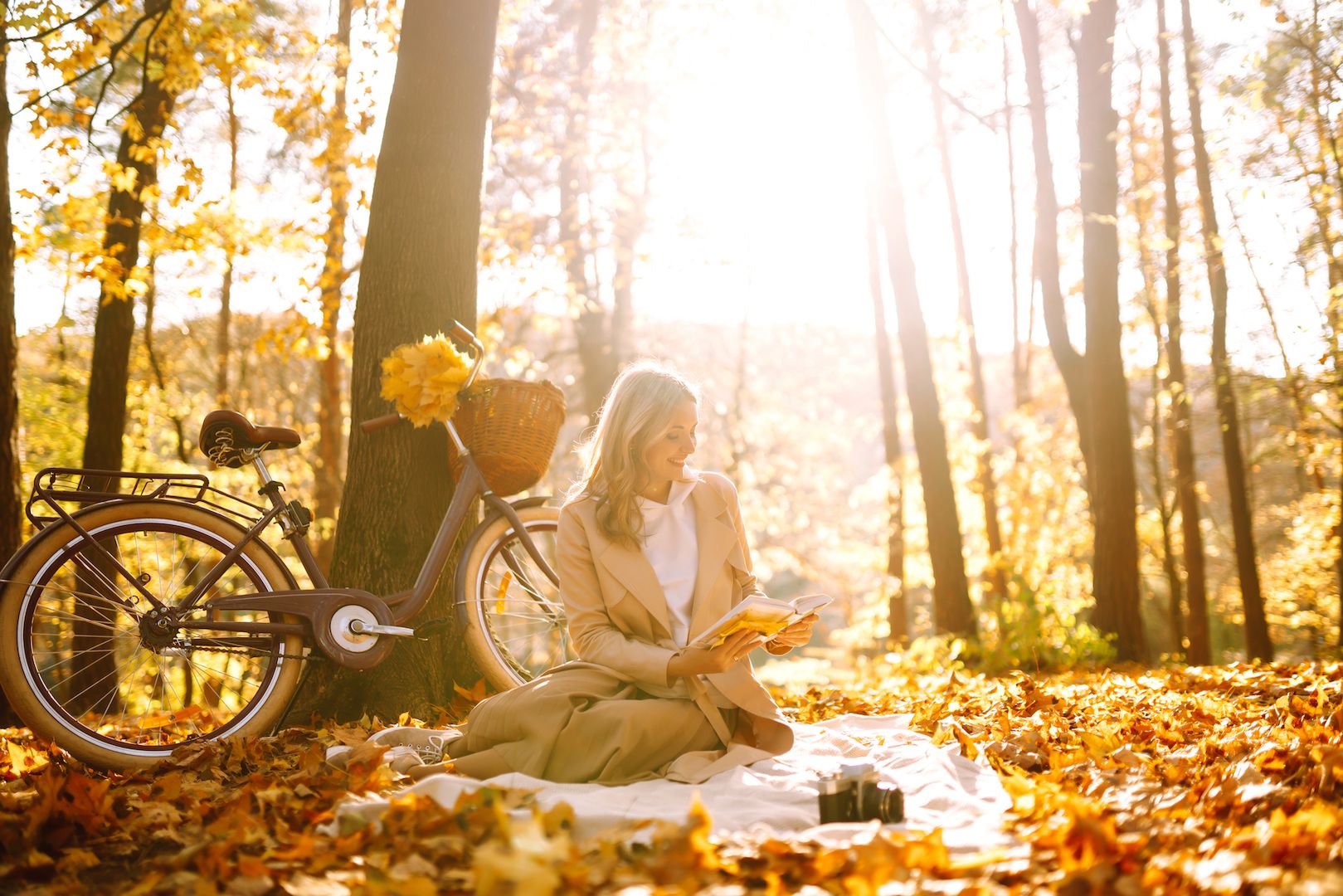 beautiful-young-woman-sitting-fallen-autumn-leaves-park-reading-book-relaxation.jpg