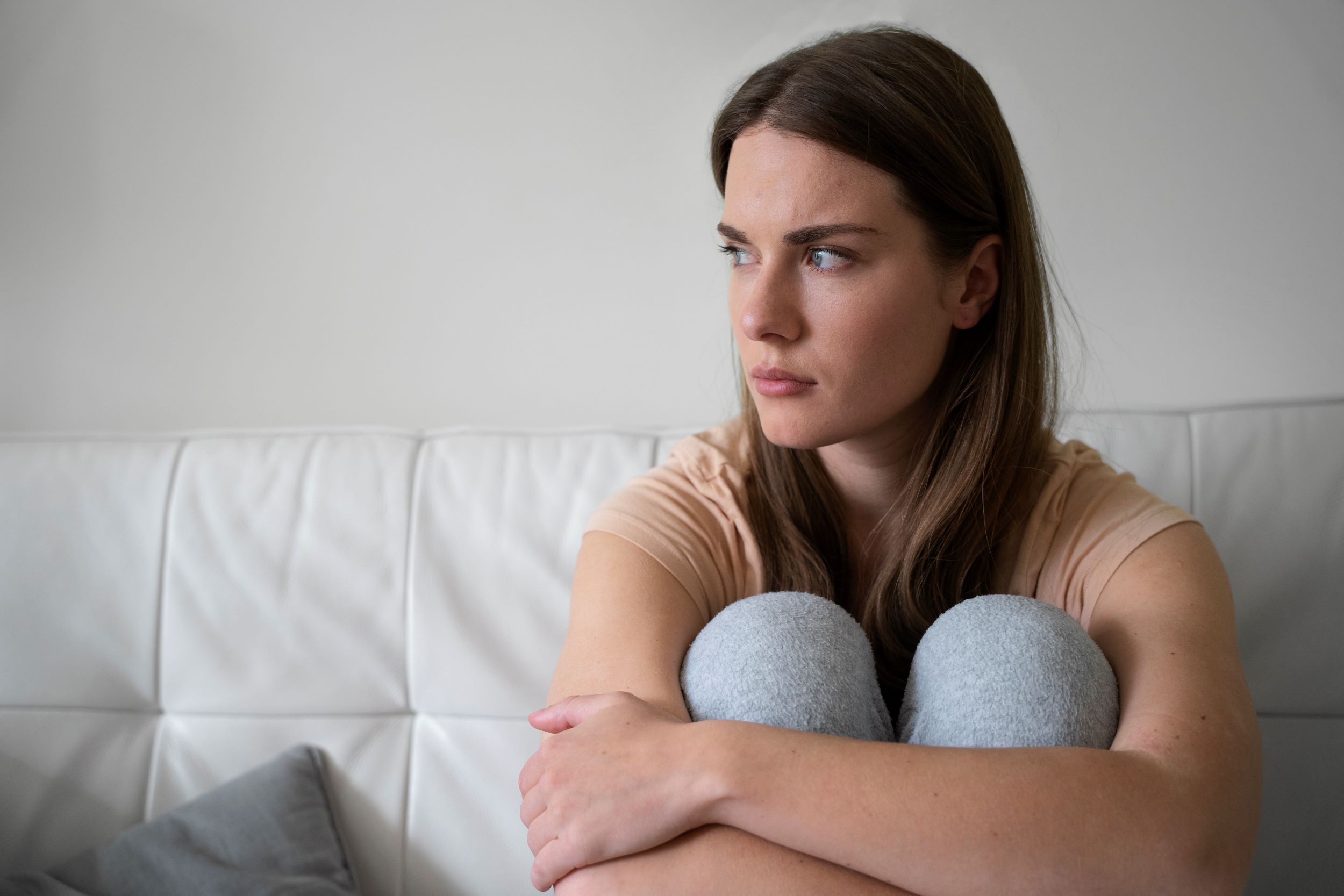 front-view-anxious-woman-couch.jpg