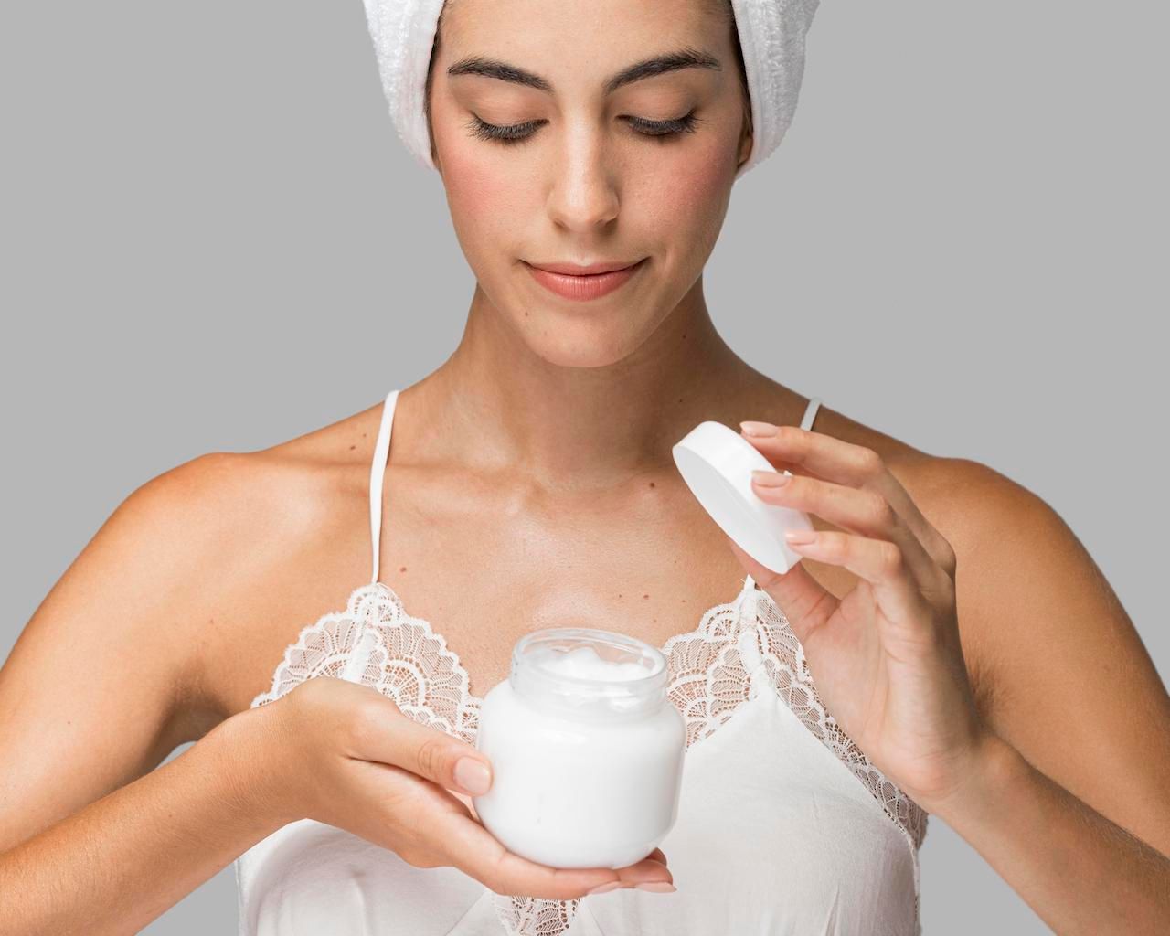 front-view-lady-holding-open-container-cream.jpg