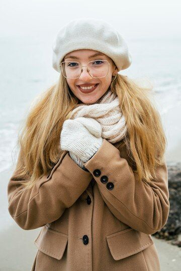 front-view-smiley-woman-outdoors-beach-winter_23-2148820458.jpeg