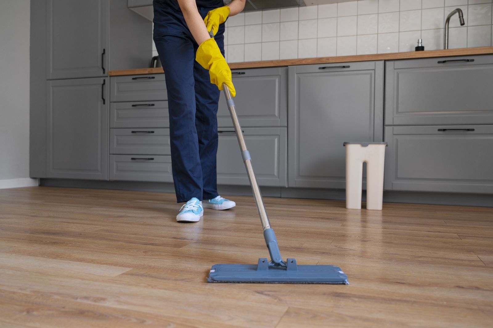 front-view-woman-cleaning-home_1600x1065.jpg