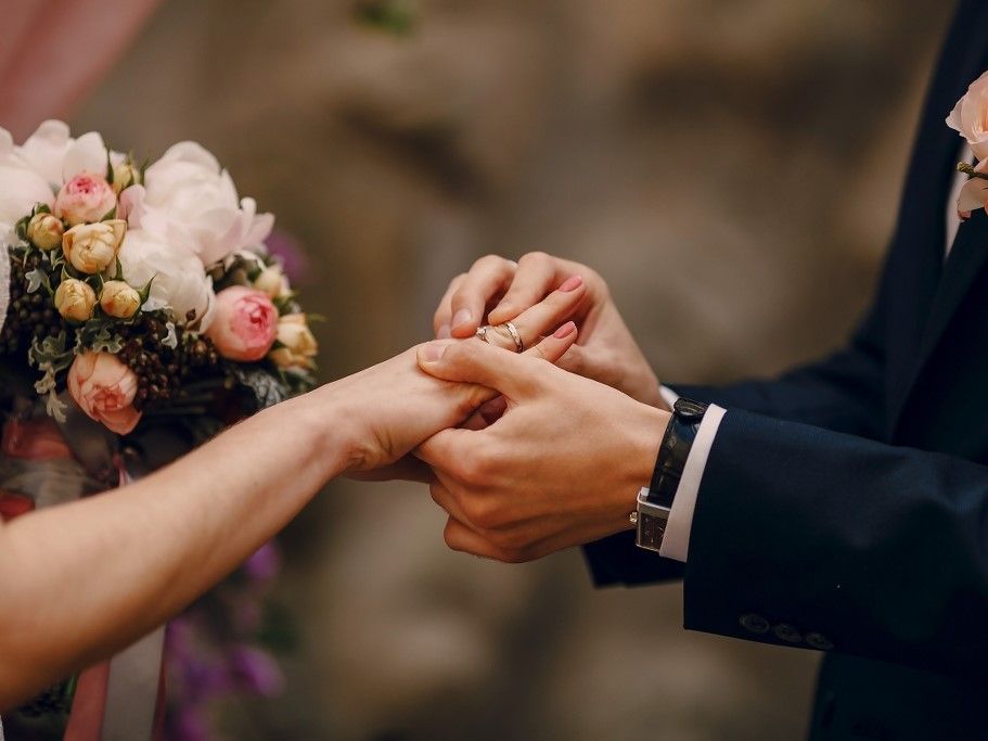 groom-putting-ring-bride-s-finger_1024x683.jpg