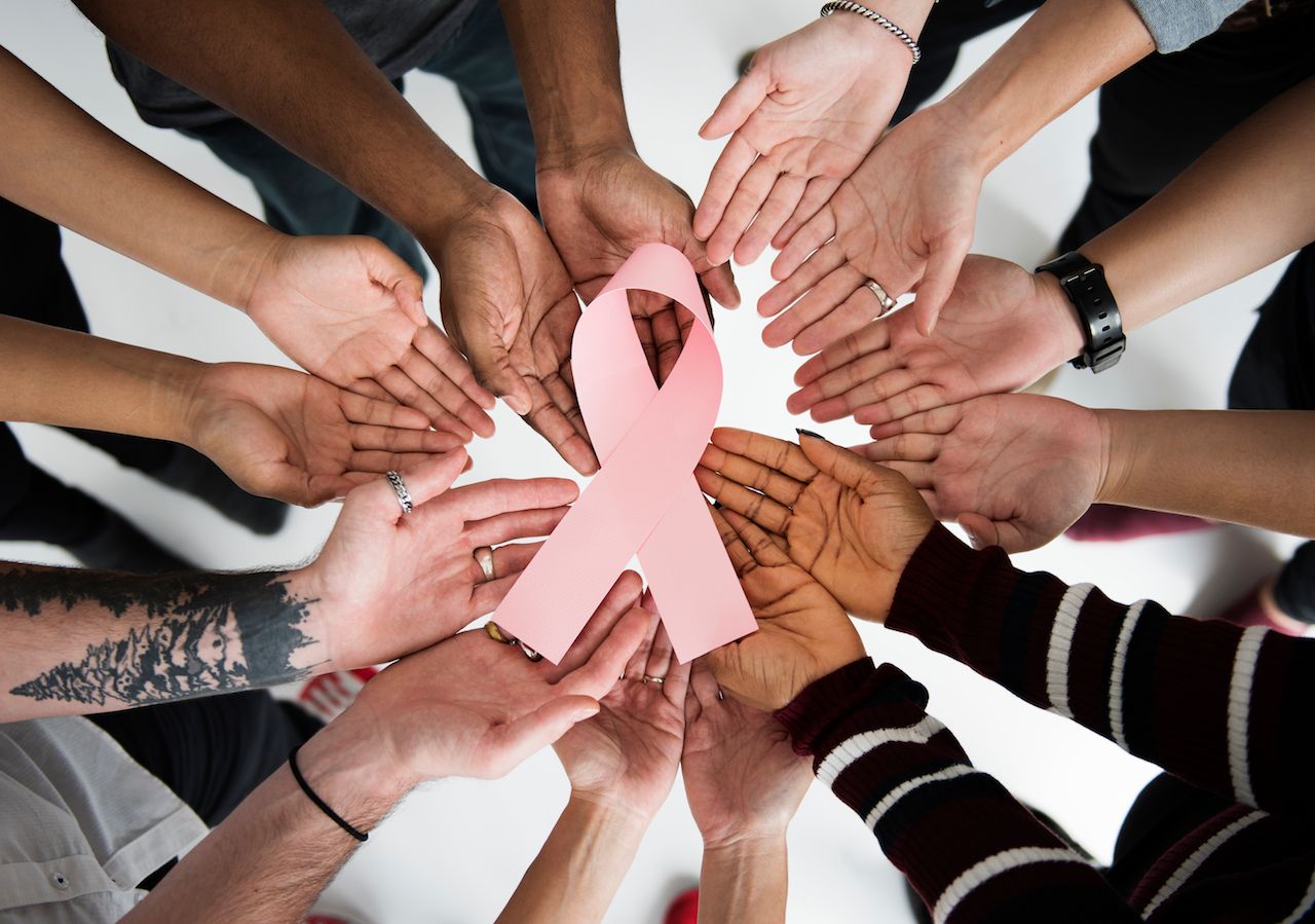 group-people-holding-ribbon-breast-cancer-concept.jpg