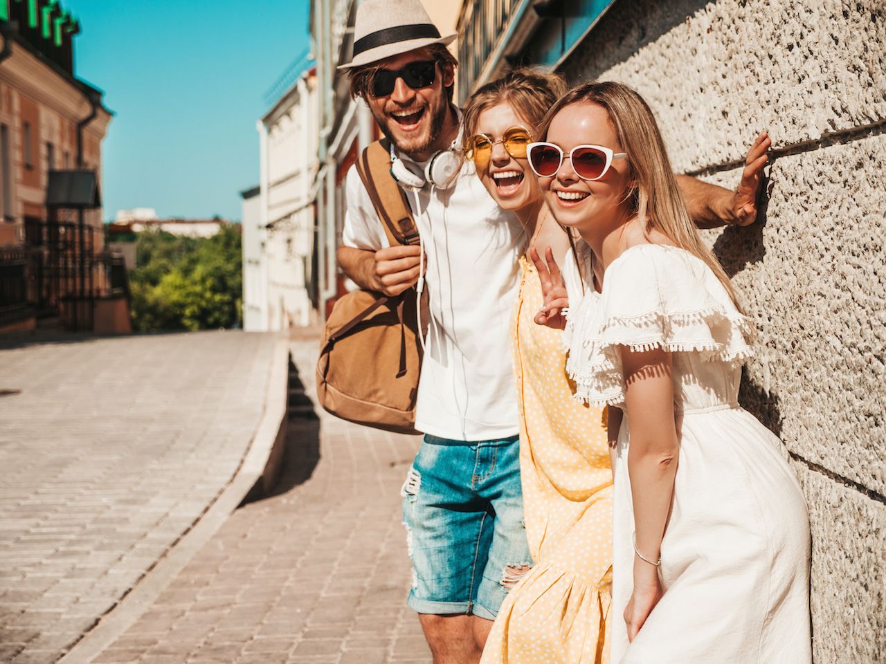 group-young-three-stylish-friends-posing-street-fashion-man-two-cute-girls-dressed-casual-summer-clothes-smiling-models-having-fun-sunglasses-cheerful-women-guy-outdoors.jpg