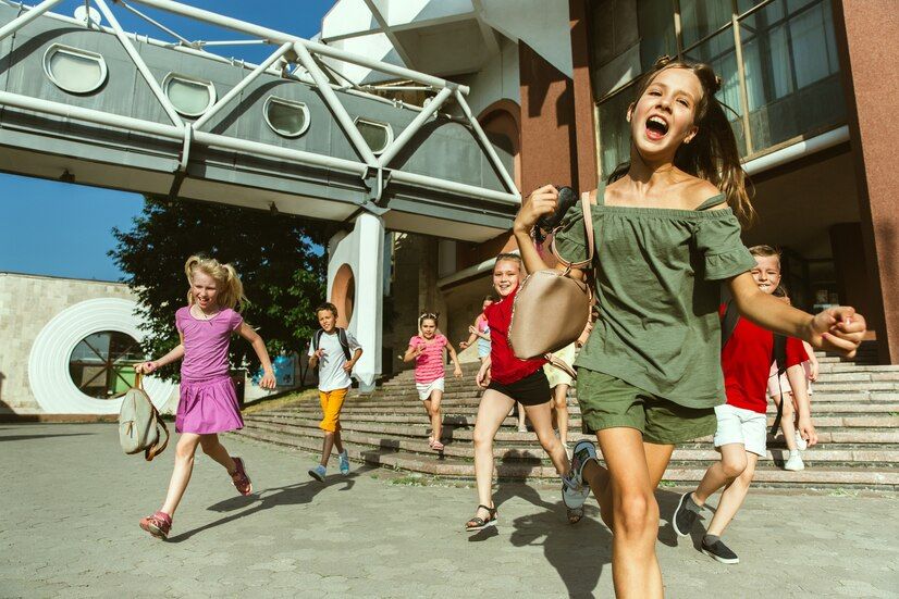 happy-kids-playing-city-s-street-sunny-summer-s-day-front-modern-building-group-happy-childrens-teenagers-having-fun-together_155003-26644.jpeg