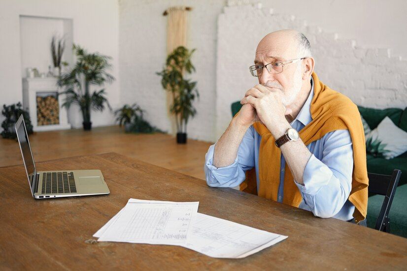 indoor-shot-unhappy-sad-senior-bearded-male-entrepreneur-sitting-desk-with-laptop-papers-having-depressed-facial-expression-frustrated-with-financial-problems-holding-hands-his-chin_343059-4860.jpg