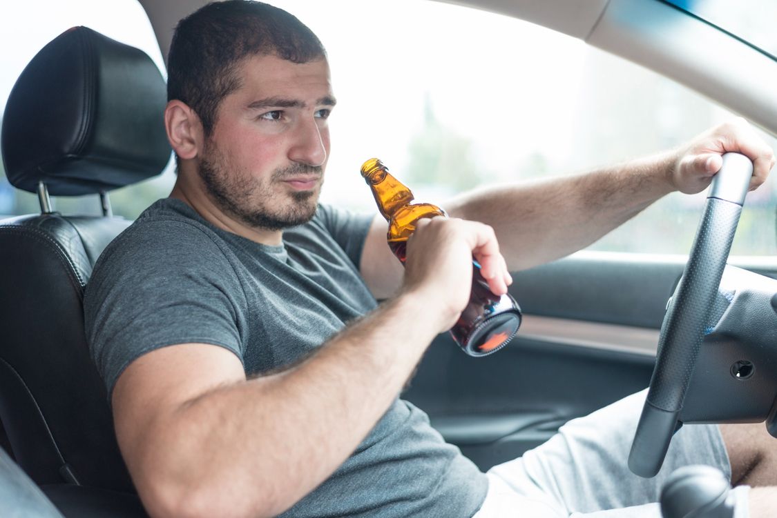 man-with-beer-driving-car (1).jpg