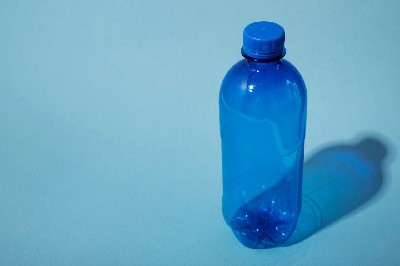 plastic-bottle-blue-background-high-angle.jpg