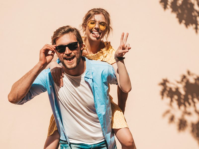 portrait-smiling-beautiful-girl-her-handsome-boyfriend-woman-casual-summer-dress-man-jeans-happy-cheerful-family-female-having-fun-street-near-wall.jpg