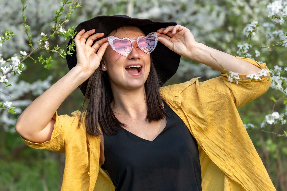 portrait-stylish-girl-flowering-trees-forest_169016-11733.jpeg