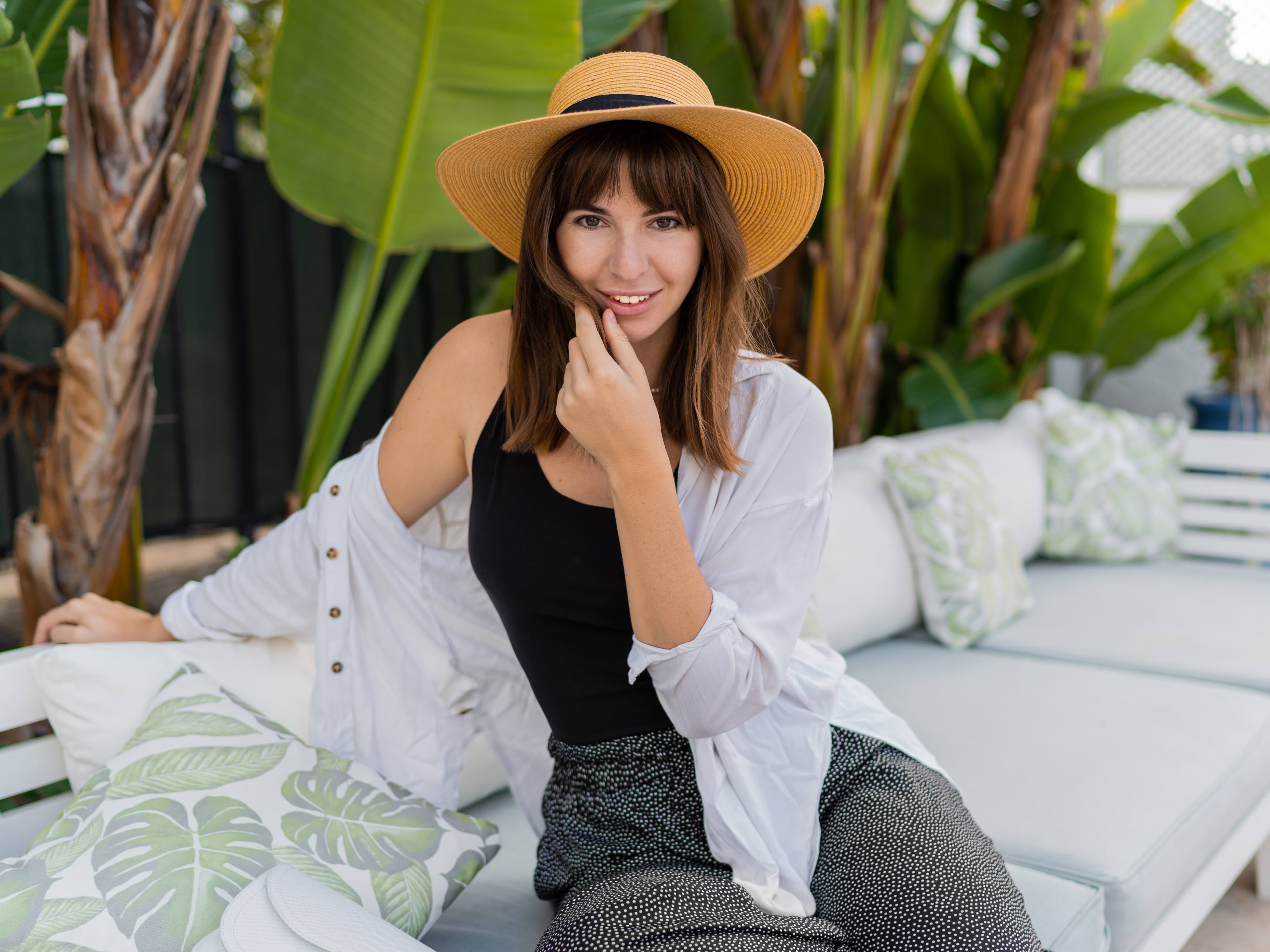 pretty-brunette-woman-straw-hat-sitting-cozy-tropical-terrace-2.jpg