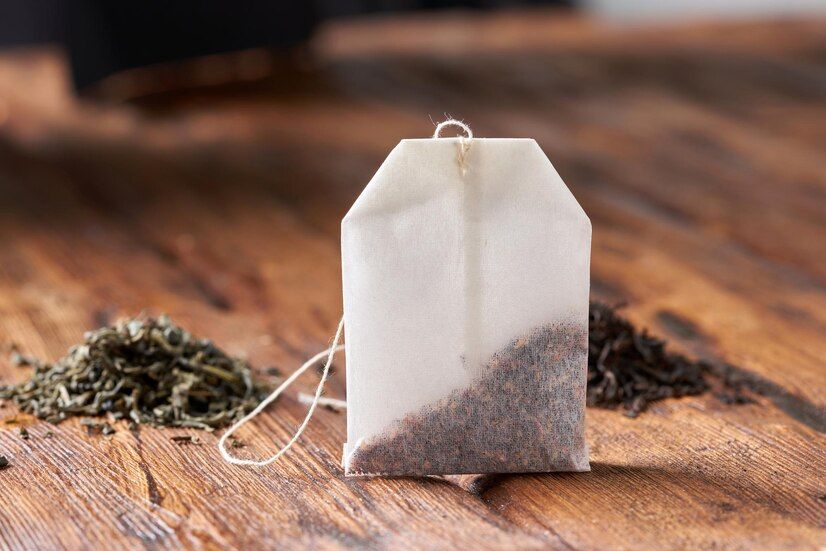 tea-bag-green-black-tea-old-wooden-table_181705-1403.jpeg