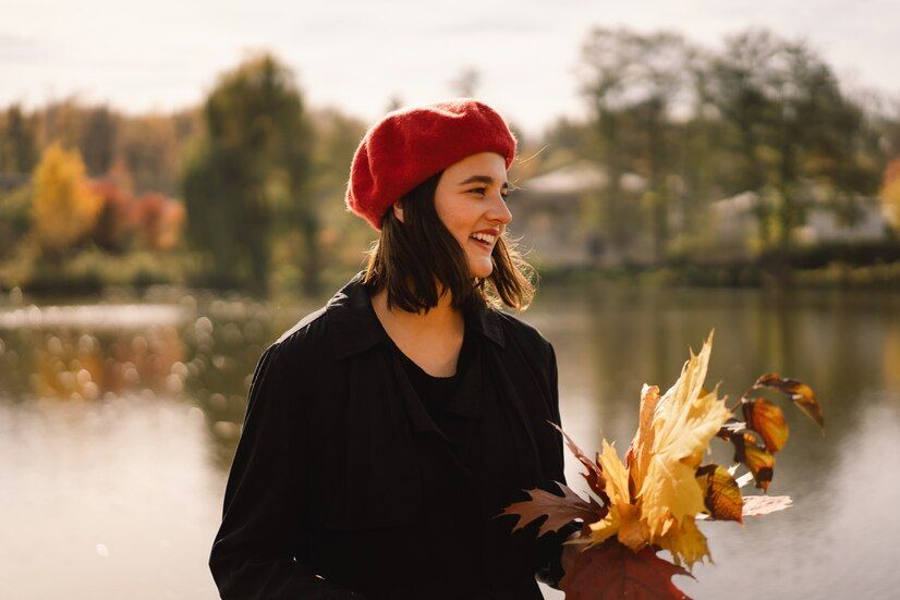 teengirl-red-beret-with-bouquet-autumn-leaves-her-hands-walks-through-forest_176445-5493.jpg