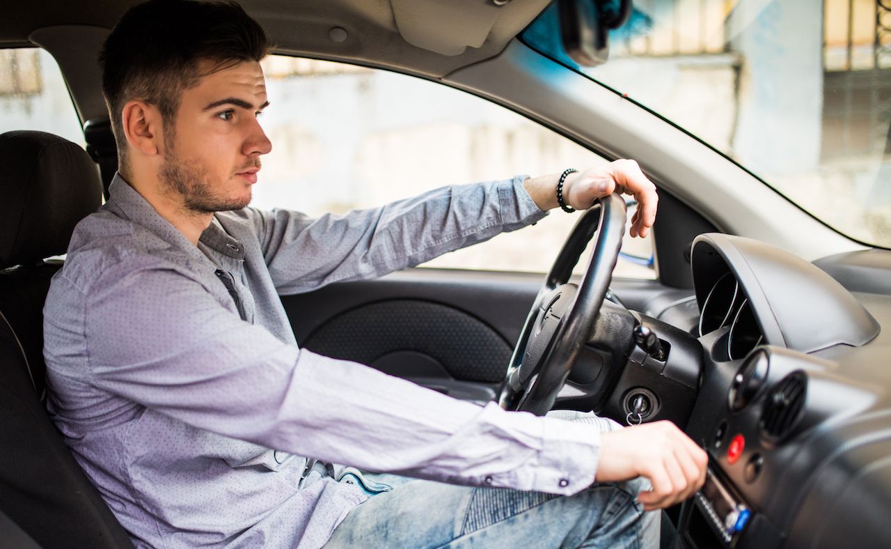 transport-business-trip-technology-people-concept-young-man-suit-driving-car-adjusting-music-volume-control-panel-stereo-system.jpg
