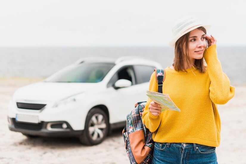 traveling-woman-with-car-background_23-2148218369.jpg