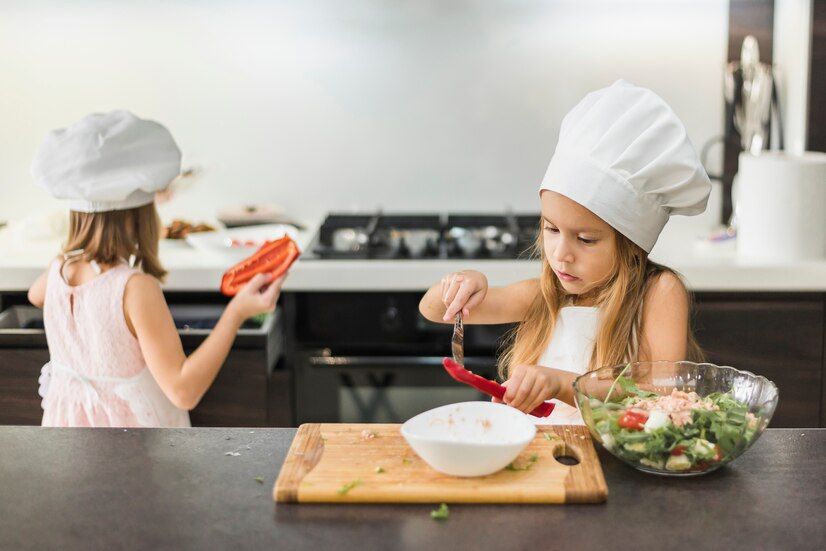 two-little-kids-chef-hat-preparing-food-kitchen_23-2148044433.jpg