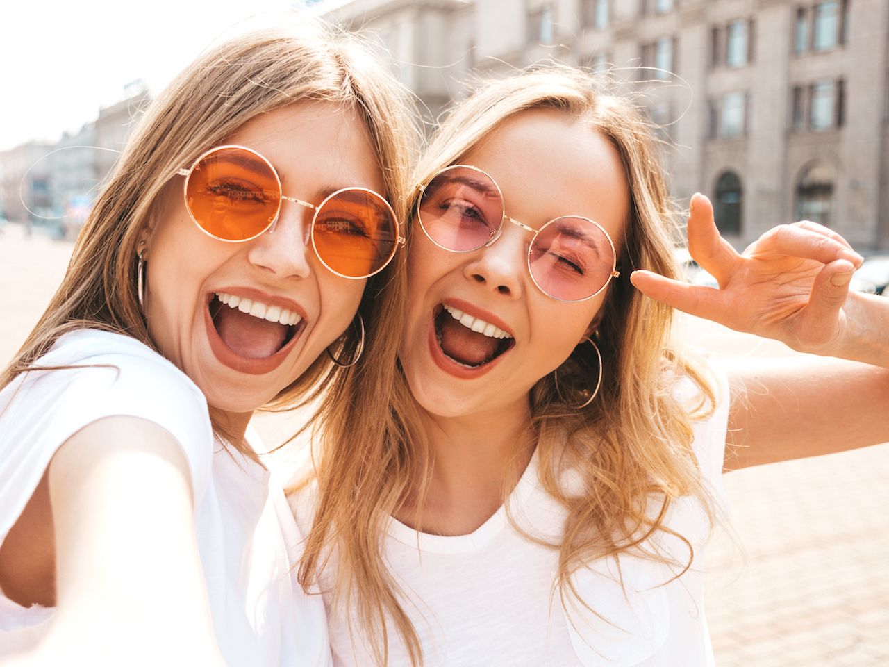 two-young-smiling-hipster-blond-women-summer-white-t-shirt-clothes.jpg