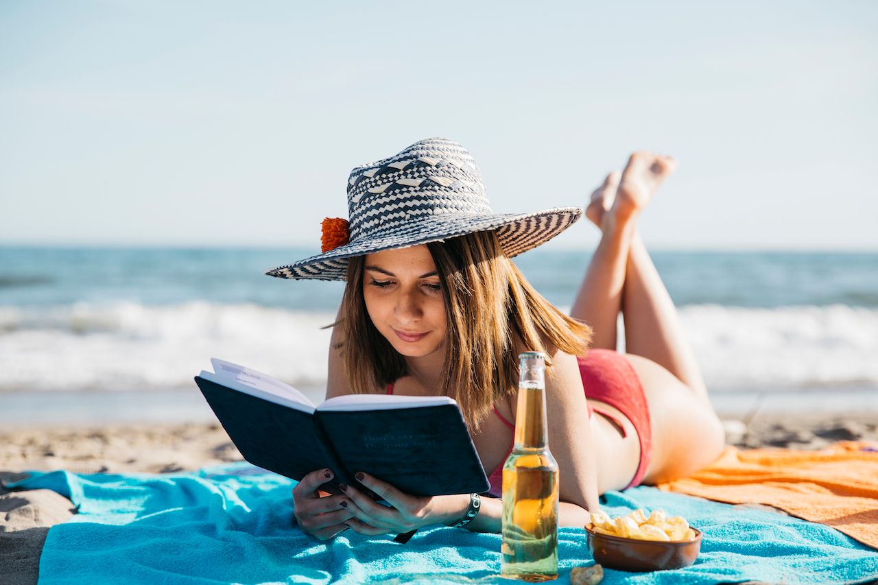 woman-reading-book-beach.jpg