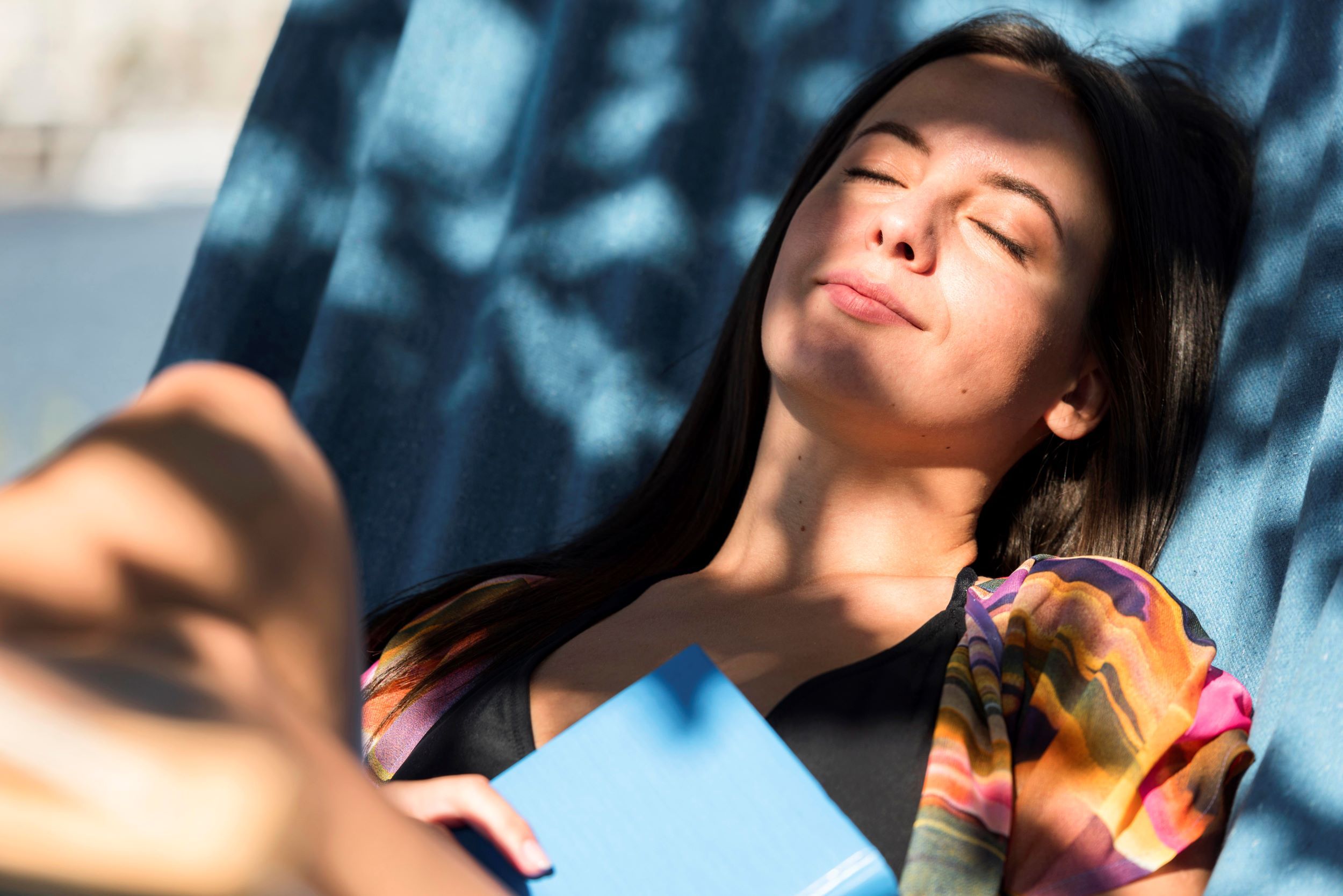 woman-relaxing-hammock-while-beach-with-book.jpg