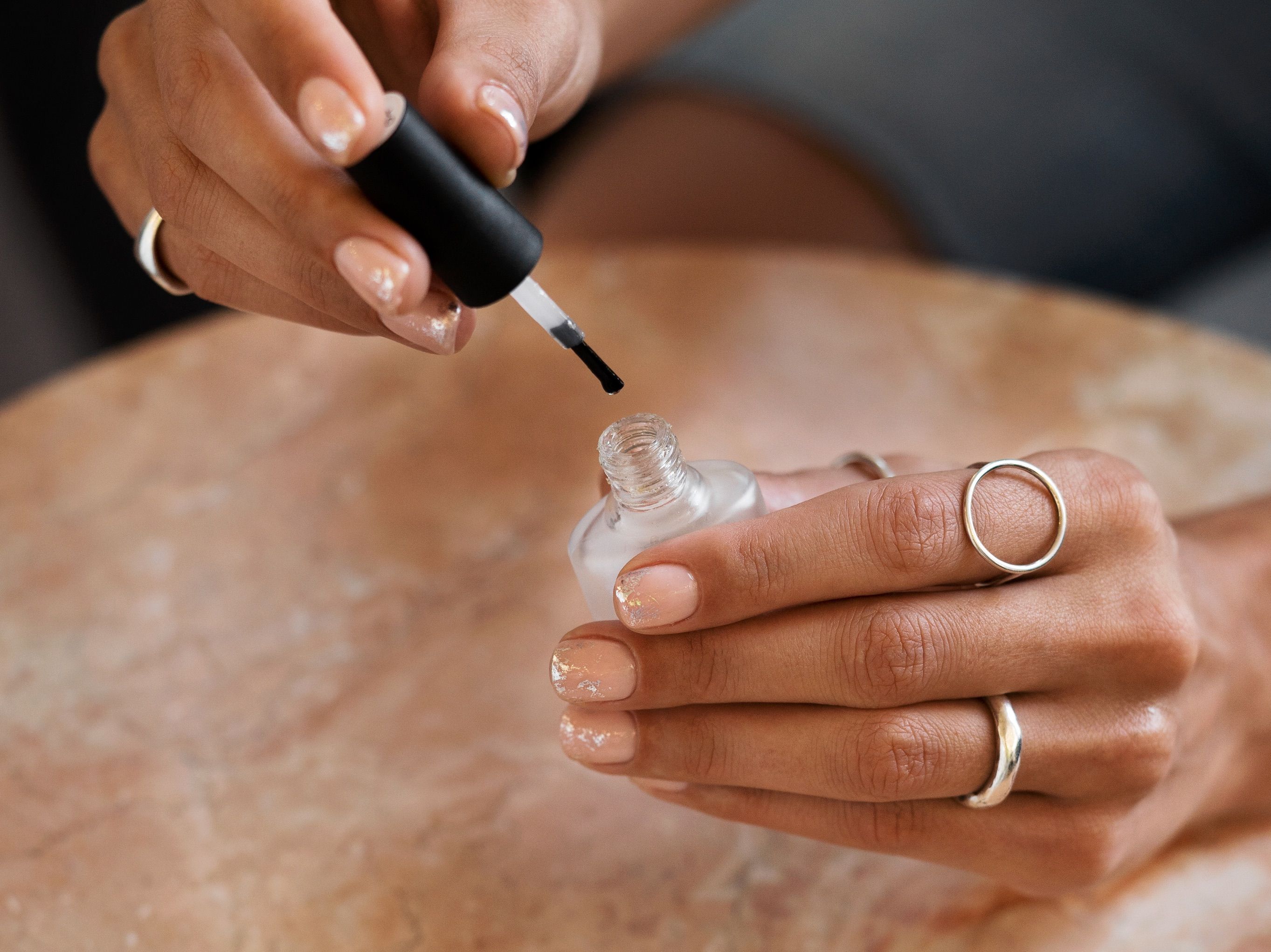woman-showing-her-nail-art-fingernails-with-varnish-2.jpg