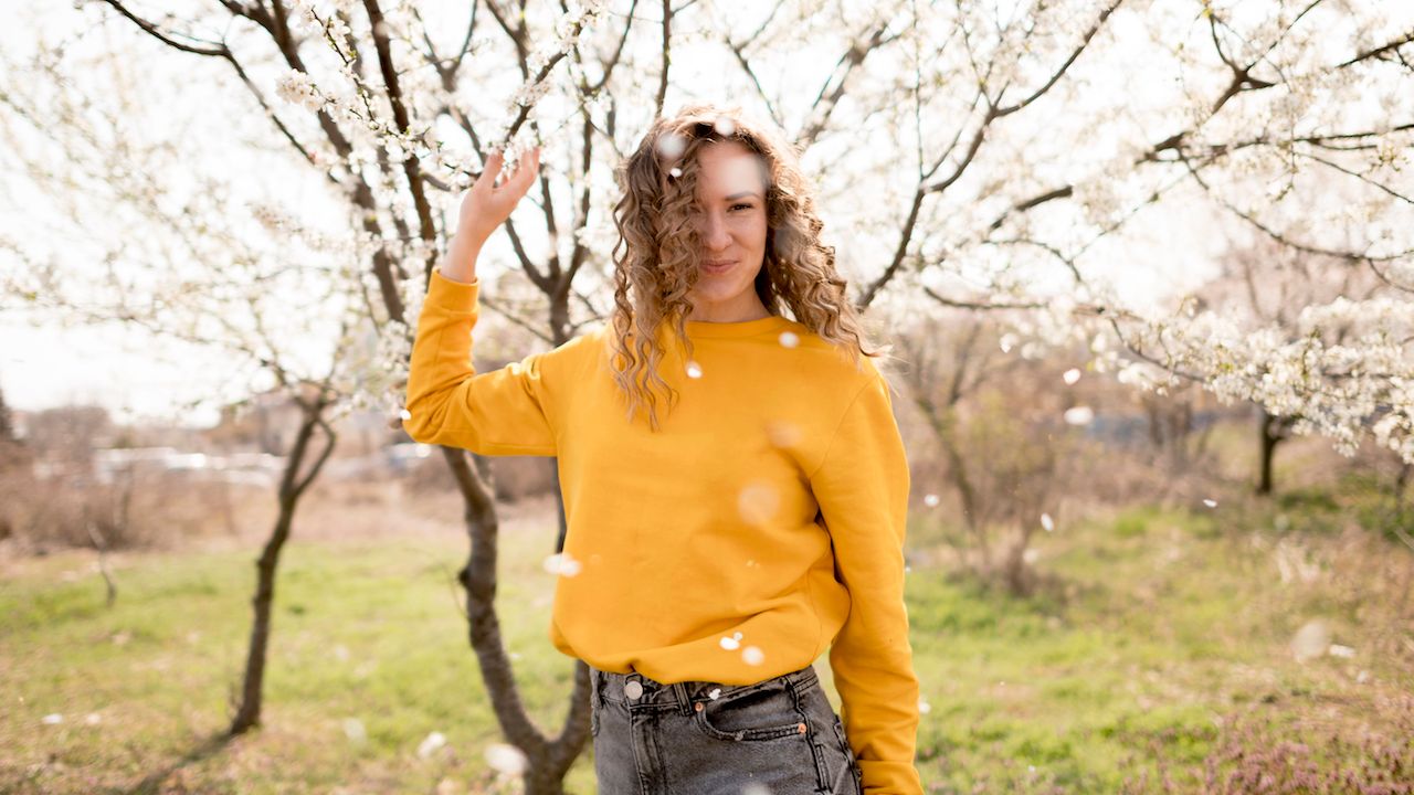 woman-wearing-yellow-shirt-flowers.jpg