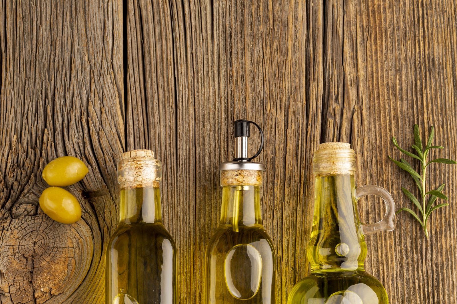yellow-olives-oil-bottles-wooden-background_1600x1067.jpg