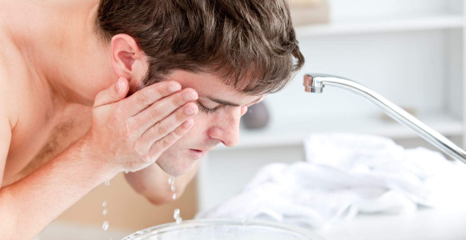 young-caucasian-man-spraying-water-his-face-after-shaving-bathroom.jpg