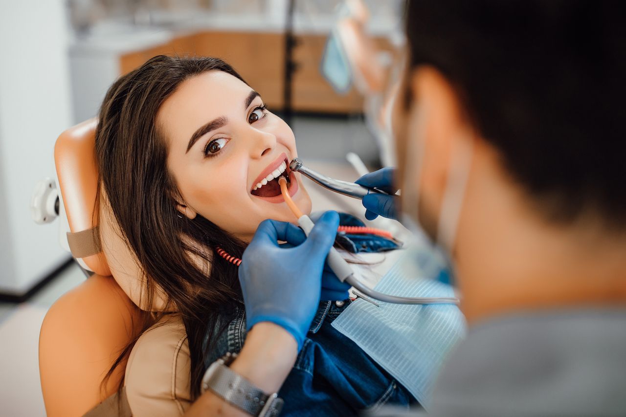 young-female-patient-visiting-dentist-office (1).jpg