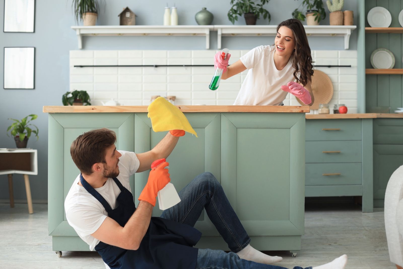 young-happy-couple-is-having-fun-while-doing-cleaning-home_1600x1067.jpg