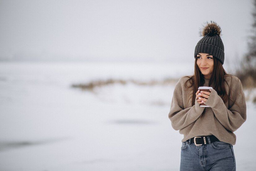 young-woman-drinking-coffee-outside-winter-park_1303-12969.jpeg