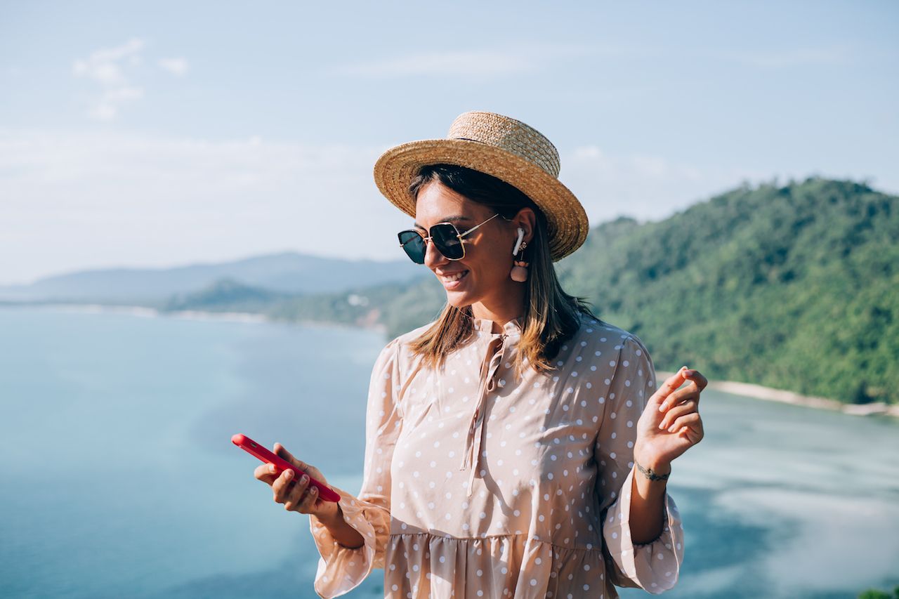 young-woman-summer-cute-dress-straw-hat-sunglasses-dancing-with-smartphone-hand-listening-music.jpg