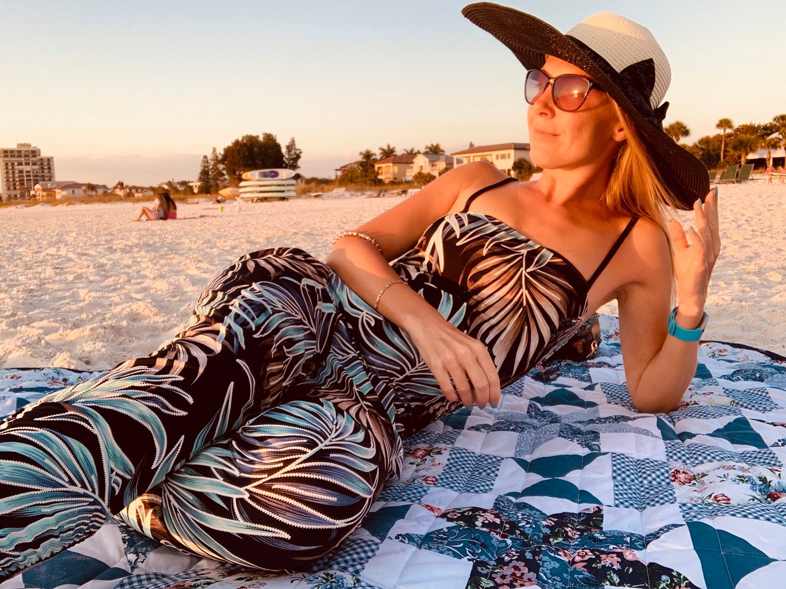 young-woman-wearing-sunglasses-sitting-beach (1).jpg